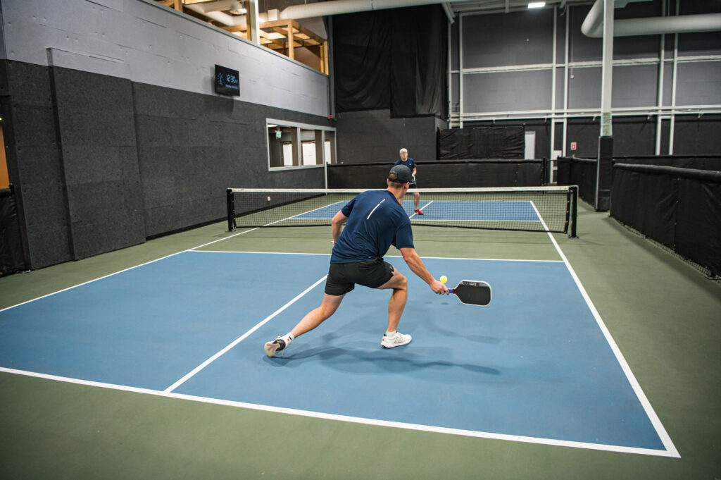 Man Diving to hit a pickleball at the EPC