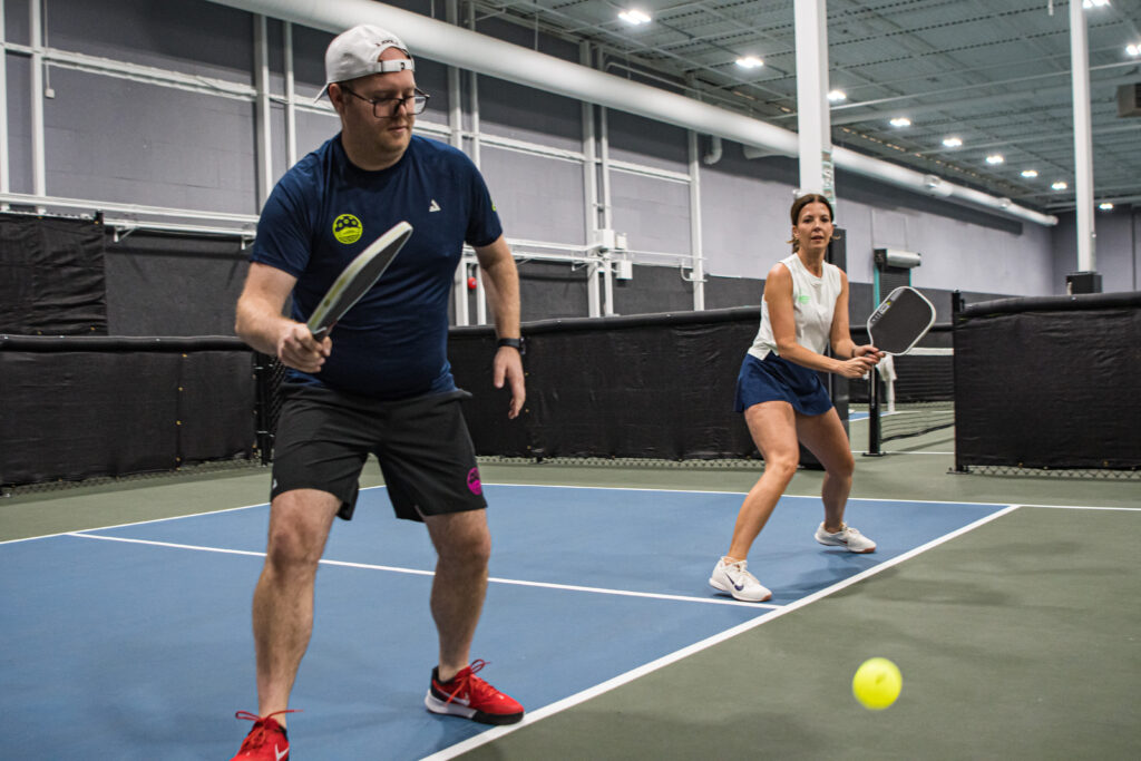A Man and Woman playing pickleball at the EPC